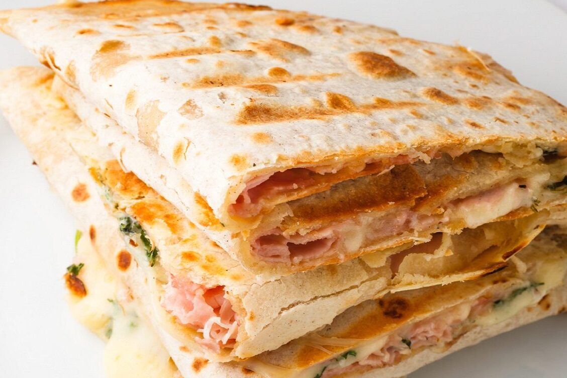 Marche e Cibo | Crescia sfogliata - Pesaro | Secret World Trip Planner