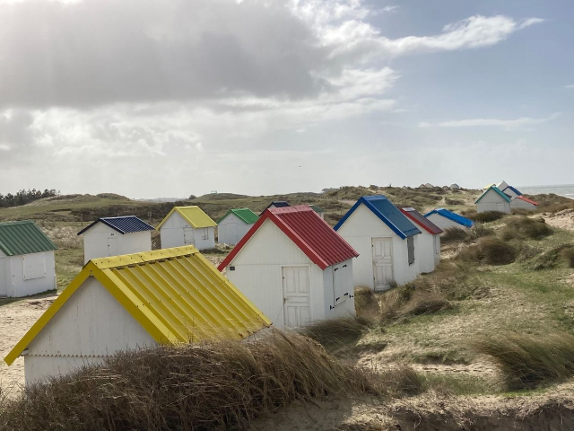 Gouville-sur-Mer and the charming beach huts - Gouville-sur-Mer | Secret World Trip Planner