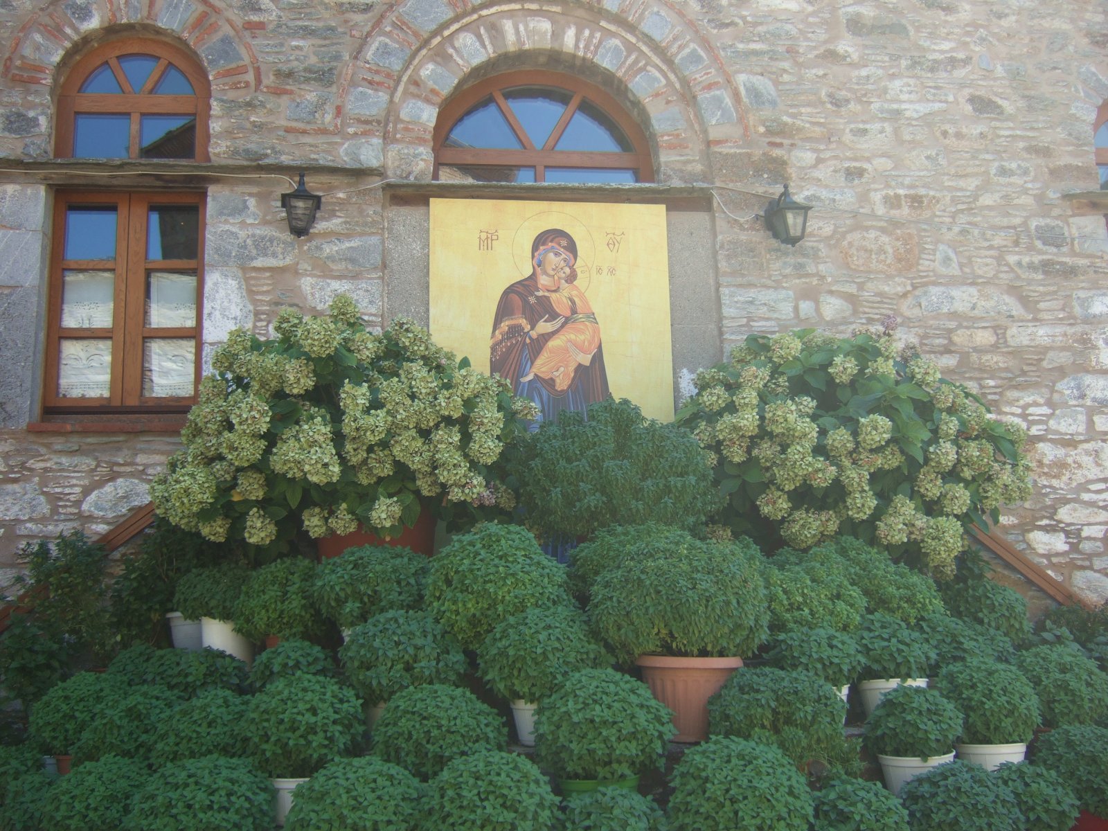 The Monastery of Panagias Evangelistrias and the Greek flag - Moni Evaggelistrias | Secret World Trip Planner